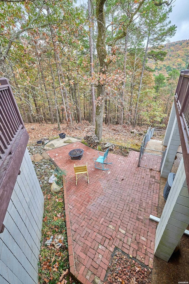 view of patio / terrace with an outdoor fire pit