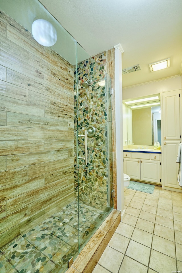 full bathroom featuring visible vents, toilet, tile patterned flooring, vanity, and a shower stall