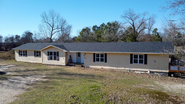 ranch-style home featuring a front yard