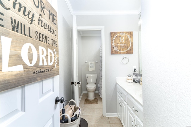 bathroom with baseboards, toilet, ornamental molding, tile patterned flooring, and vanity