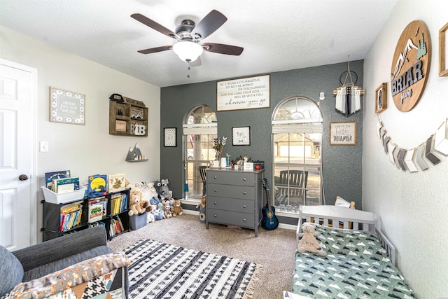 carpeted bedroom featuring a ceiling fan