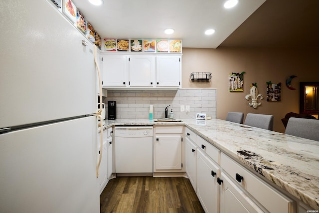 740 Weston Rd Unit A-508, Hot Springs, AR 71913 - kitchen featuring recessed lighting, dark wood-style flooring, white appliances, white cabinetry, and backsplash