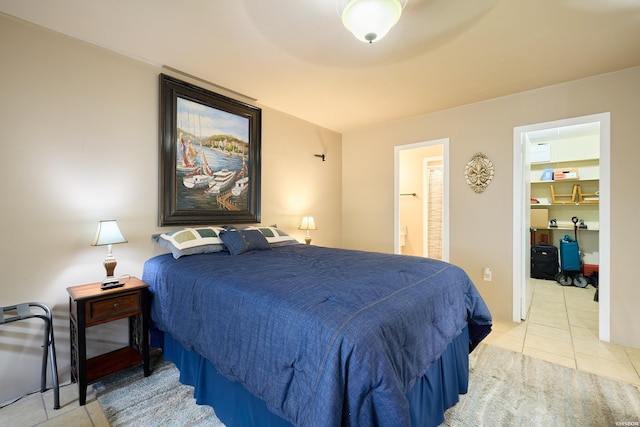740 Weston Rd Unit A-508, Hot Springs, AR 71913 - bedroom with light tile patterned floors, ensuite bathroom, and a spacious closet
