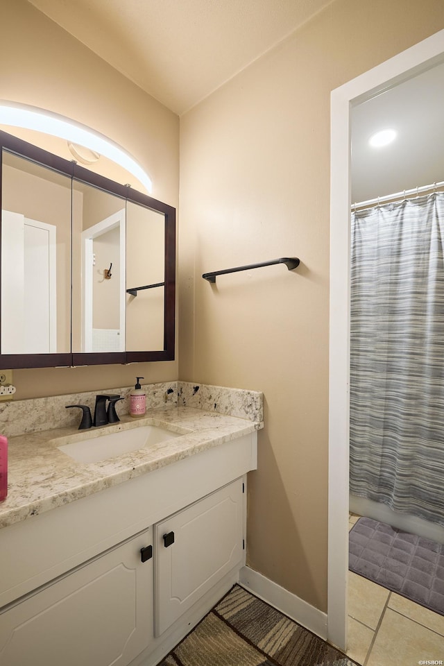 740 Weston Rd Unit A-508, Hot Springs, AR 71913 - bathroom featuring tile patterned floors, baseboards, vanity, and a shower with curtain