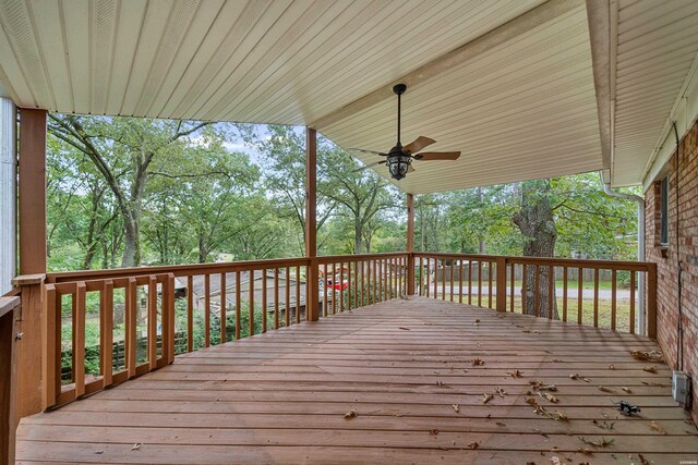 wooden deck featuring a ceiling fan