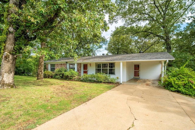 single story home with a carport, concrete driveway, and a front yard