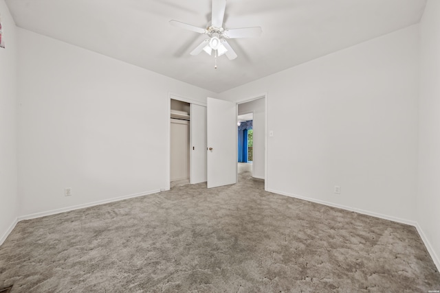 unfurnished bedroom featuring ceiling fan, carpet floors, a closet, and baseboards