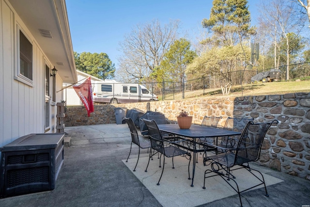 view of patio featuring outdoor dining space and a fenced backyard