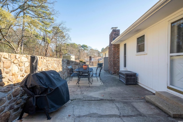 view of patio / terrace featuring entry steps, outdoor dining space, area for grilling, and fence