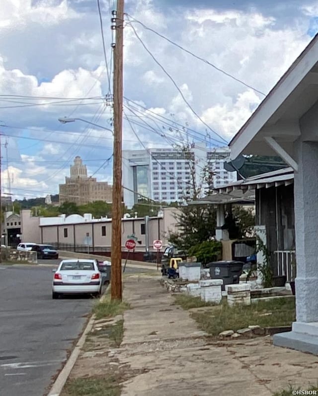 view of street with street lighting, a view of city, and curbs