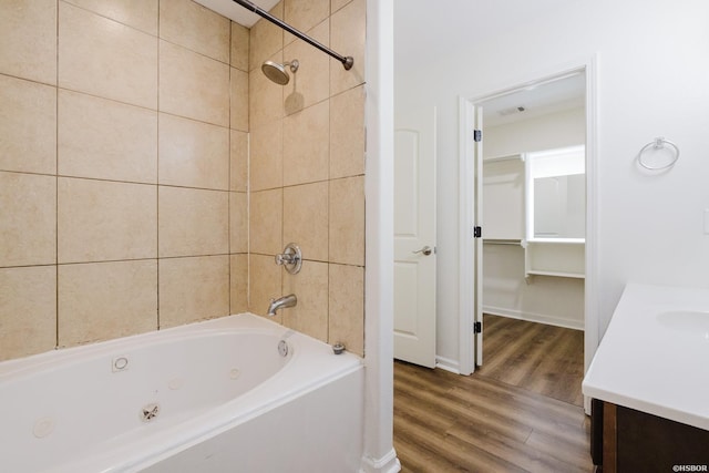 710 Fair Ln, Alexander, AR 72002 - full bath with a combined bath / shower with jetted tub, baseboards, wood finished floors, and vanity