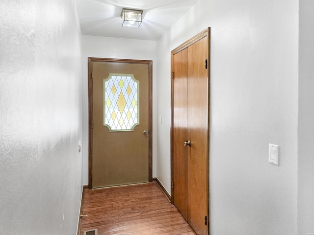 doorway featuring light wood finished floors