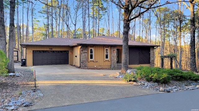 view of front of property with driveway, a shingled roof, crawl space, and an attached garage