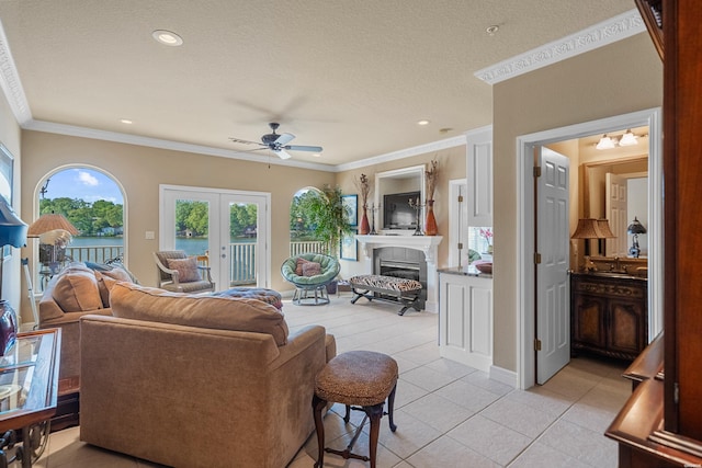 1380 Airport Rd Unit C2, Hot Springs, AR 71913 - living room featuring ceiling fan, light tile patterned floors, crown molding, a water view, and a glass covered fireplace