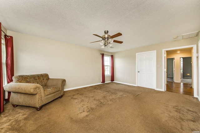 261 Pin Oak Dr, Bismarck, AR 71929 - living area featuring carpet flooring, a ceiling fan, and a textured ceiling