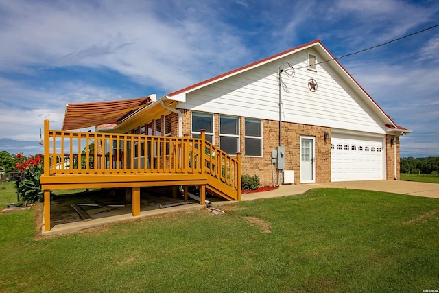 261 Pin Oak Dr, Bismarck, AR 71929 - rear view of property featuring brick siding, a yard, a garage, a deck, and driveway