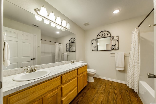 261 Pin Oak Dr, Bismarck, AR 71929 - bathroom with double vanity, wood finished floors, and shower / bath combination with curtain