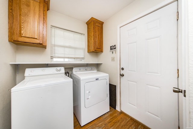 261 Pin Oak Dr, Bismarck, AR 71929 - laundry room featuring washer and clothes dryer, cabinet space, and wood finished floors