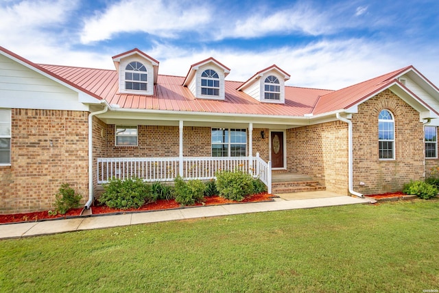 261 Pin Oak Dr, Bismarck, AR 71929 - view of front of house with brick siding, a front lawn, covered porch, and a metal roof