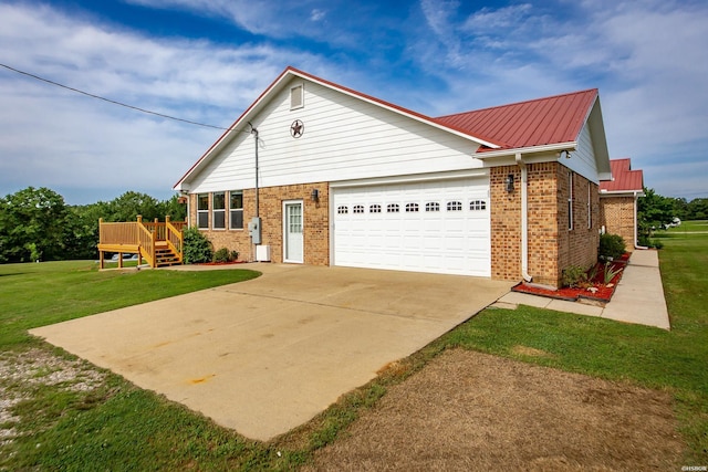 261 Pin Oak Dr, Bismarck, AR 71929 - view of front of home with brick siding, a garage, driveway, and a front lawn