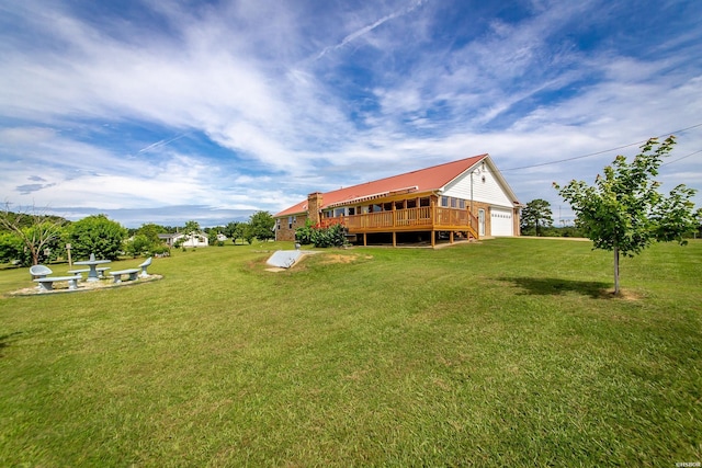 261 Pin Oak Dr, Bismarck, AR 71929 - view of green lawn featuring a garage and a wooden deck