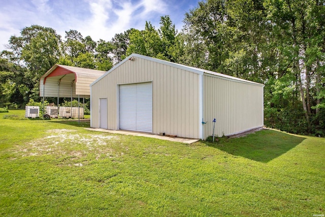 261 Pin Oak Dr, Bismarck, AR 71929 - detached garage featuring a carport and view of wooded area