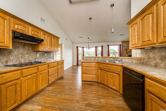 261 Pin Oak Dr, Bismarck, AR 71929 - kitchen with black appliances, under cabinet range hood, dark wood-type flooring, hanging light fixtures, and backsplash