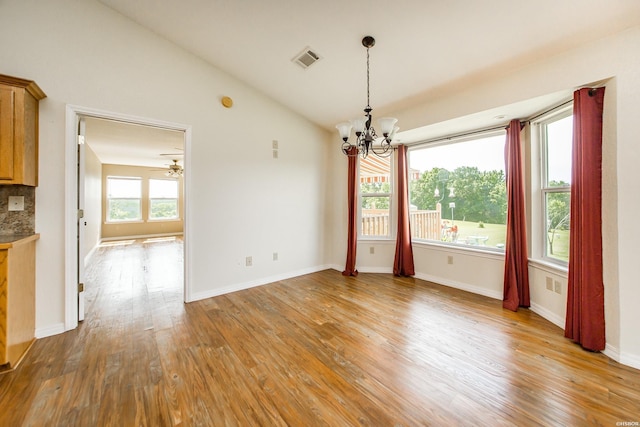 261 Pin Oak Dr, Bismarck, AR 71929 - unfurnished dining area with a chandelier, light wood finished floors, vaulted ceiling, and a ceiling fan