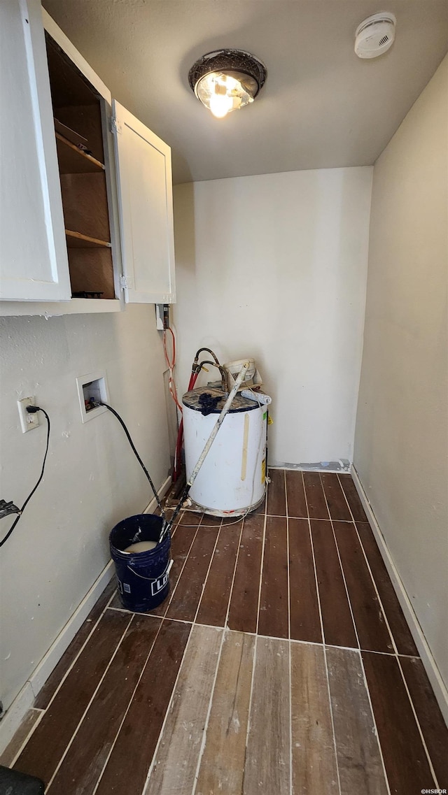 417 Mississippi St Unit B, Hot Springs, AR 71901 - washroom featuring cabinet space, hardwood / wood-style flooring, hookup for a washing machine, and baseboards