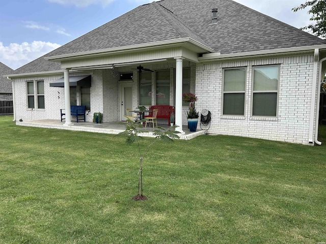 135 Callaway Cir, Hot Springs, AR 71913 - back of house featuring roof with shingles, brick siding, and a yard