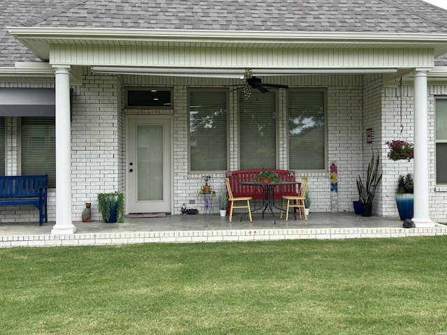 135 Callaway Cir, Hot Springs, AR 71913 - view of exterior entry featuring a porch, a shingled roof, brick siding, and ceiling fan