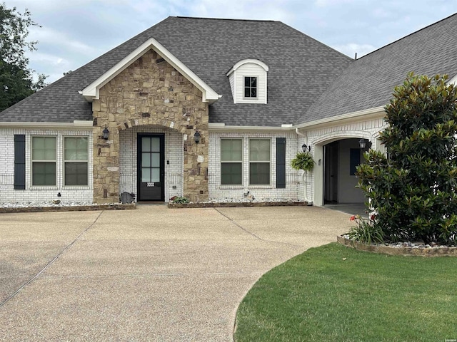 135 Callaway Cir, Hot Springs, AR 71913 - view of front of home featuring roof with shingles, stone siding, brick siding, and a front lawn