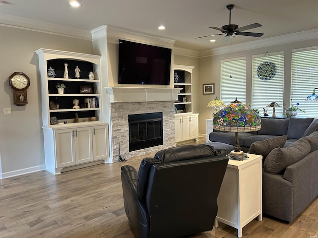 135 Callaway Cir, Hot Springs, AR 71913 - living area featuring a ceiling fan, ornamental molding, wood finished floors, recessed lighting, and a fireplace with flush hearth