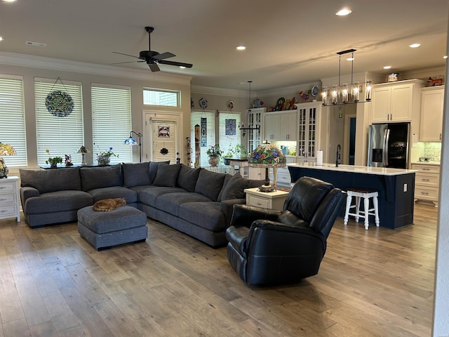 135 Callaway Cir, Hot Springs, AR 71913 - living room featuring crown molding, a ceiling fan, hardwood / wood-style flooring, recessed lighting, and a chandelier