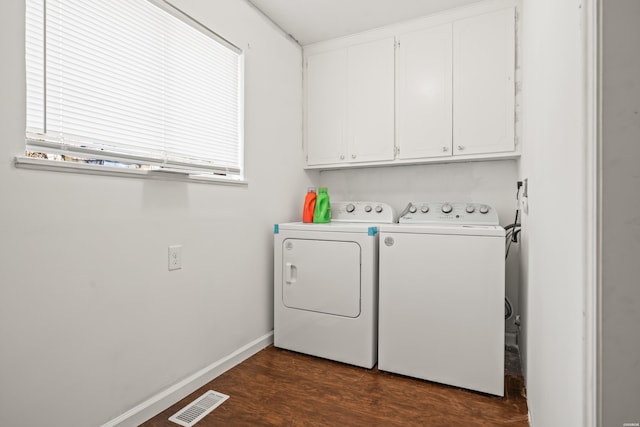 laundry area featuring cabinet space, baseboards, visible vents, dark wood-style flooring, and washer and dryer