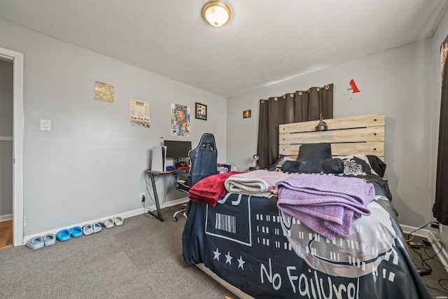 carpeted bedroom featuring a textured ceiling and baseboards