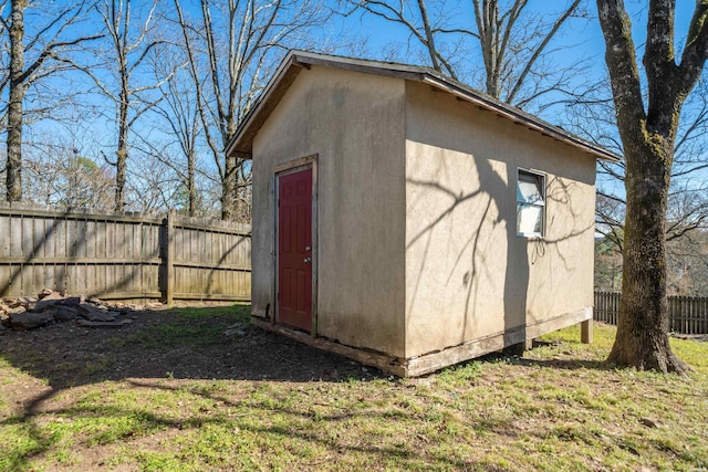 view of shed with a fenced backyard