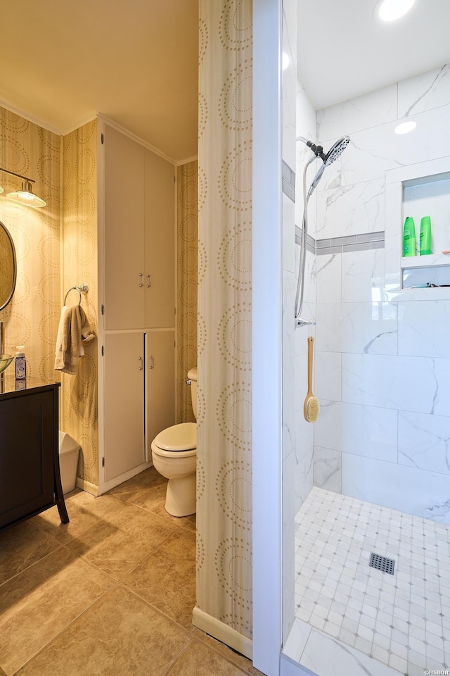 full bathroom with a stall shower, vanity, and toilet