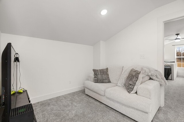 living area with vaulted ceiling, recessed lighting, baseboards, and light colored carpet