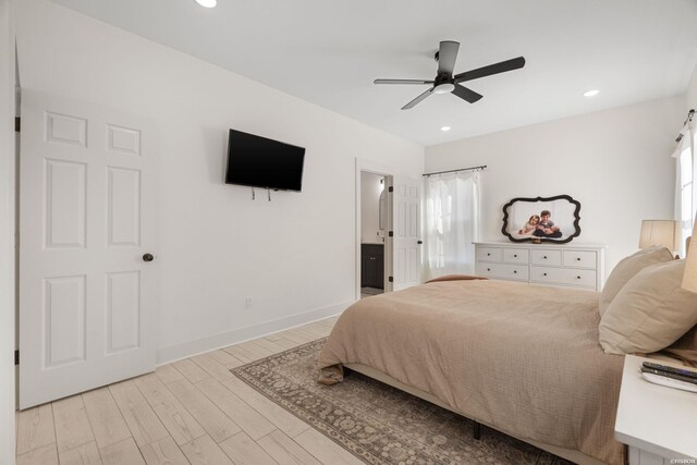 bedroom with light wood-type flooring, multiple windows, baseboards, and recessed lighting