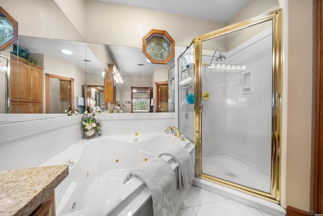 bathroom featuring lofted ceiling, a tub with jets, tile patterned flooring, vanity, and a shower stall