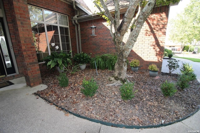 view of property exterior featuring brick siding