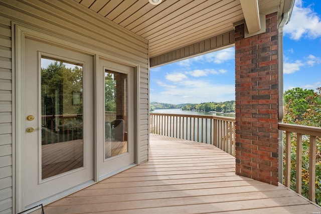 wooden deck with a water view