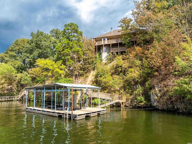 view of dock featuring a water view and boat lift