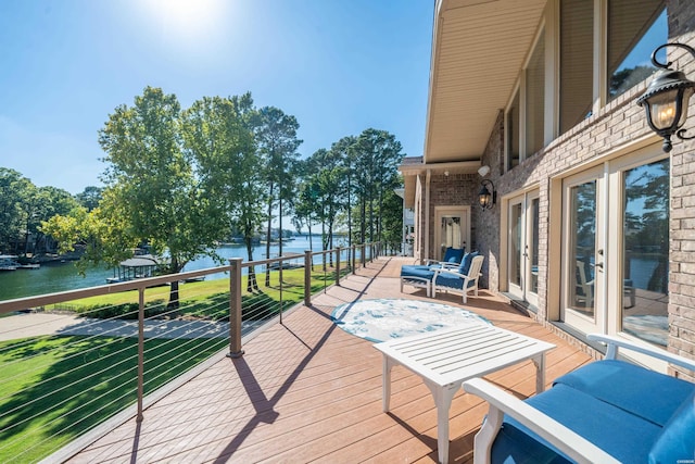 deck with an outdoor hangout area and a water view