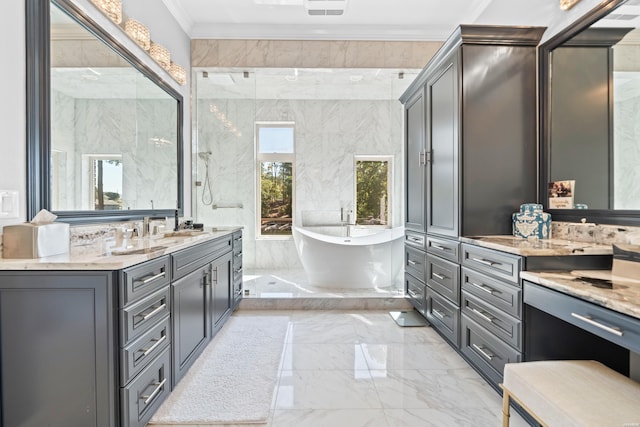 full bath featuring visible vents, ornamental molding, marble finish floor, a freestanding bath, and vanity