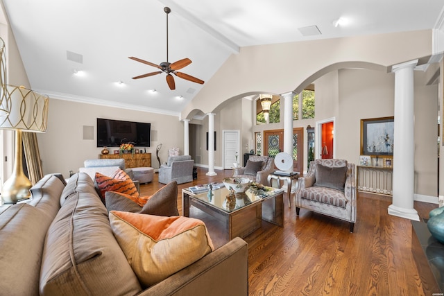 living area featuring dark wood-style flooring, visible vents, ceiling fan, beamed ceiling, and ornate columns