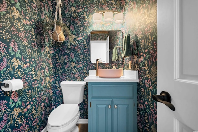 bathroom featuring toilet and wallpapered walls