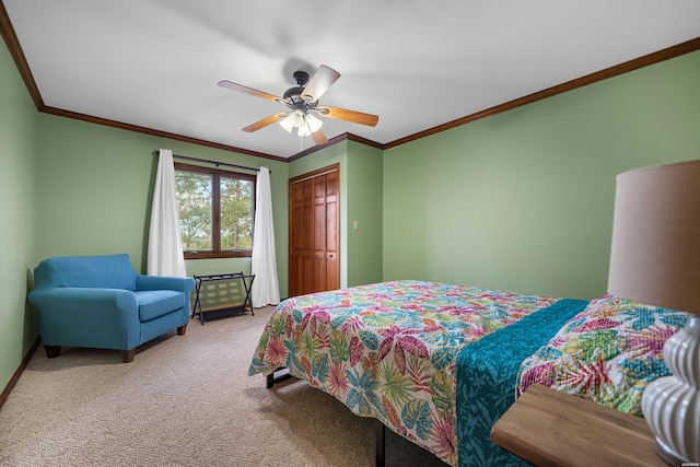 bedroom with a ceiling fan, a closet, light carpet, and crown molding