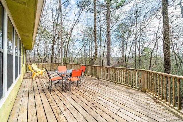 deck with outdoor dining space